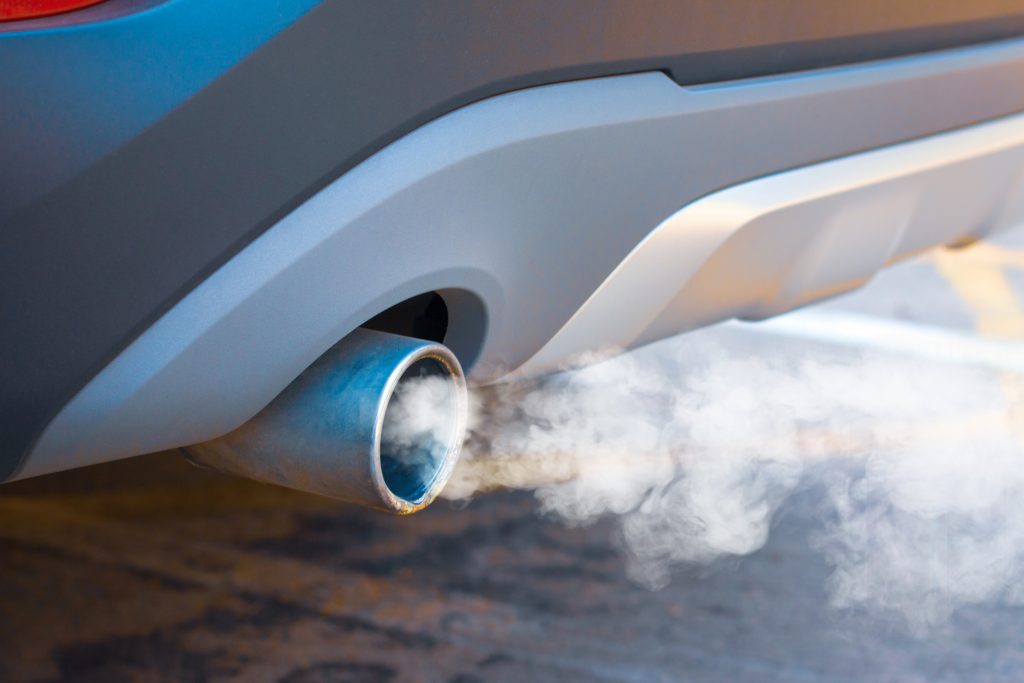 Waste smoke, the crisis of urban air pollution from car diesel exhaust on the road. Concept: transport or health prevention air pollution..